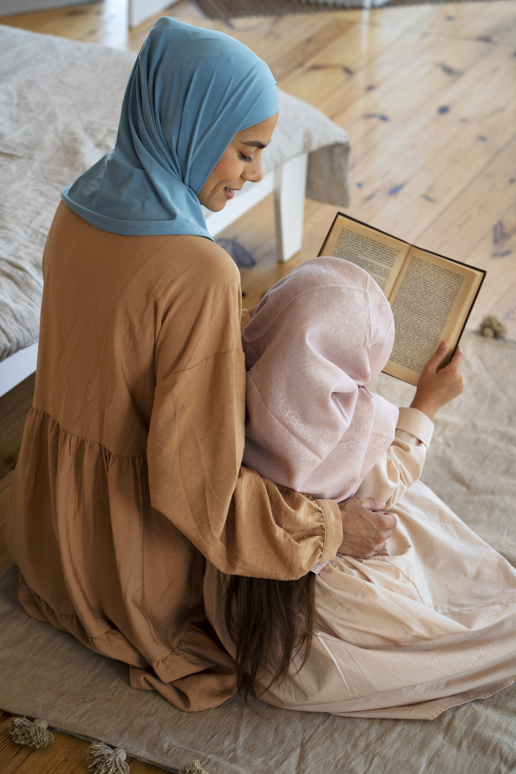 high-angle-girl-mother-reading-together