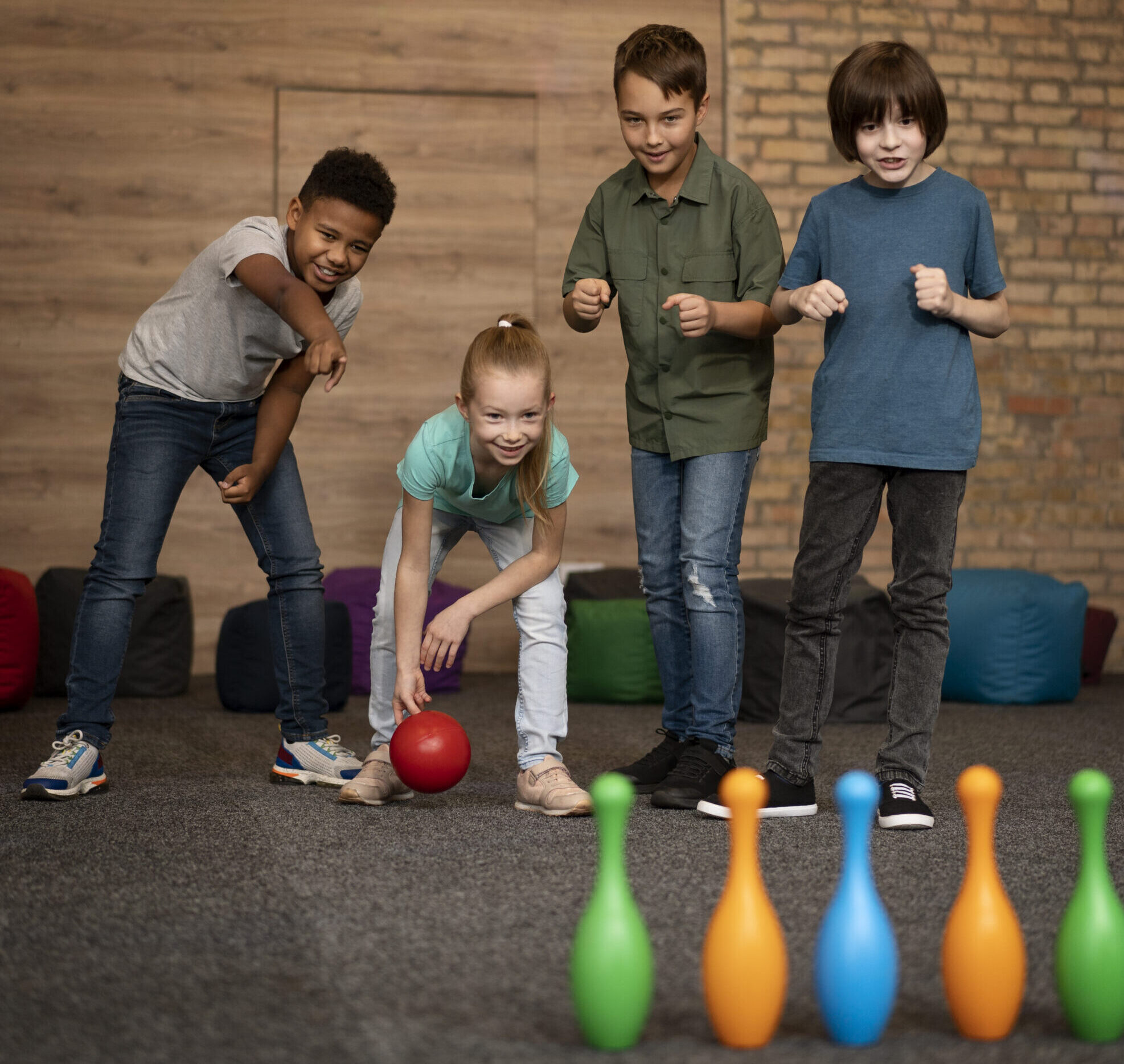 full-shot-kids-playing-bowling-scaled
